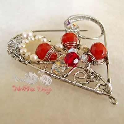 Close up of the wire wrapped Heart brooch with pearl, agate and swarovski crystals