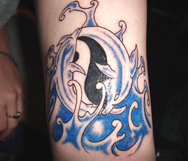 Black and grey dolphin tattoos by thai tattoo studio, pattaya, thailand