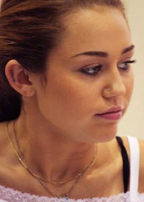 miley cyrus new ear tattoo design