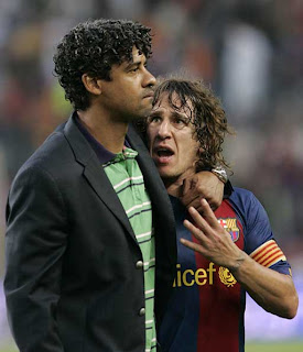 rijkaard-puyol-tristes.jpg