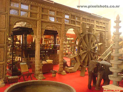 antiques shop in cochin jew street displaying antiques pieces and timber sculptures and copper alloy statues for sale and exhibition for the tourists coming to kerala