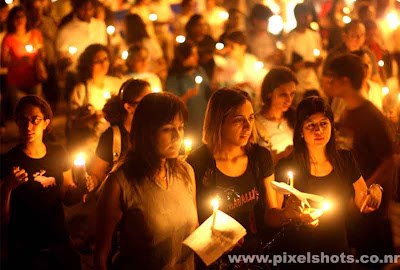 candle procession by people of mumbai india for peace after terrorists attacked mumbai on 6/11 