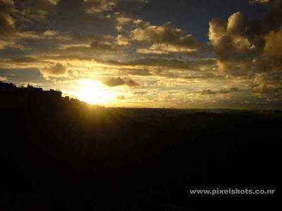 sunset sceneries in horizon with clouds photographed