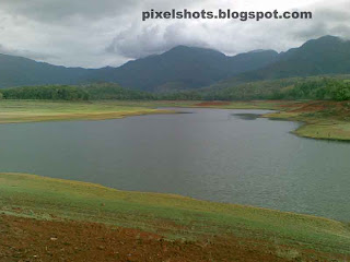 river bank and river valley photograph from the mangalam dam reservoir site in palakkad kerala