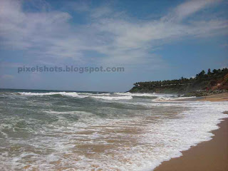 beach waves spreading on the beach and wetting the beach sand,fine beach sand leveled in wave activity