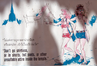 tourists don't go shirtless, in shorts, hot pants in temple in thailand