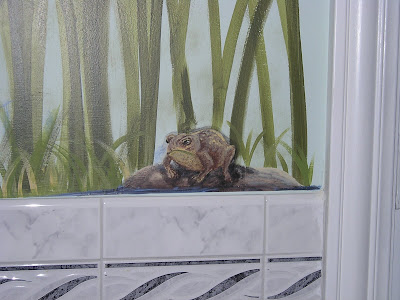 Painted frog wall mural in bathroom