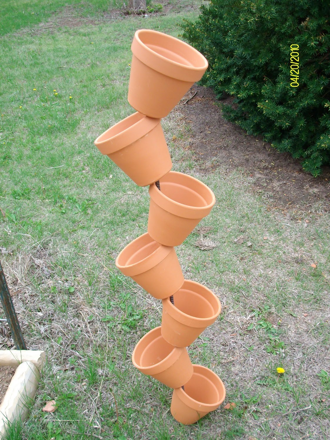 Doing my best for Him Leaning plant pot tower