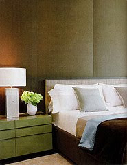 bedroom with brown walls and green wood dresser