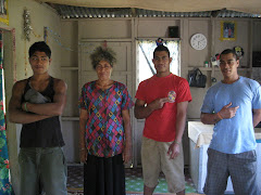 Guys and their mom in their home at O'ua