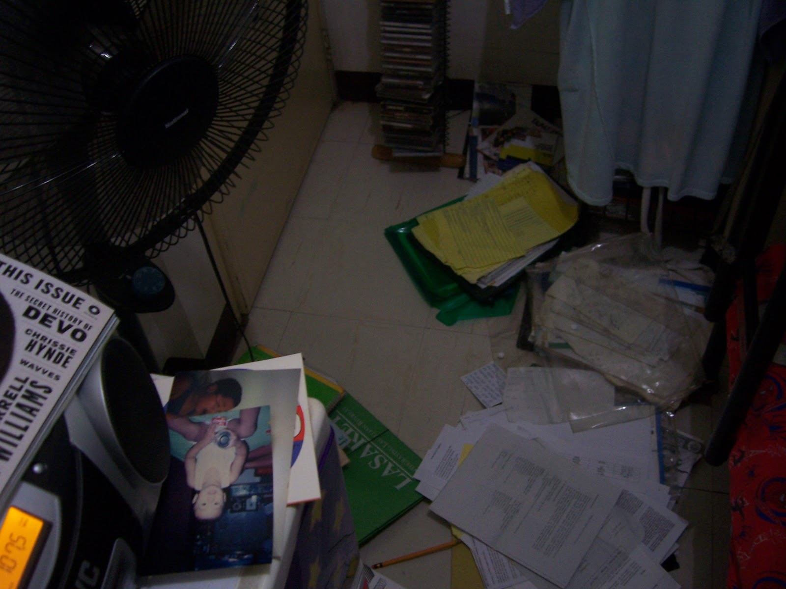 Friday night in my bedroom, with papers and whatnot from seven years of high school and college sorted out on the floor. And the electric fan, and the radio, and my sister's stuff.