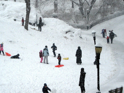 children snow sledding