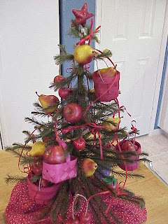 Fruit Christmas Tree with Tiny Red Baskets, and Red Bows Wallpaper