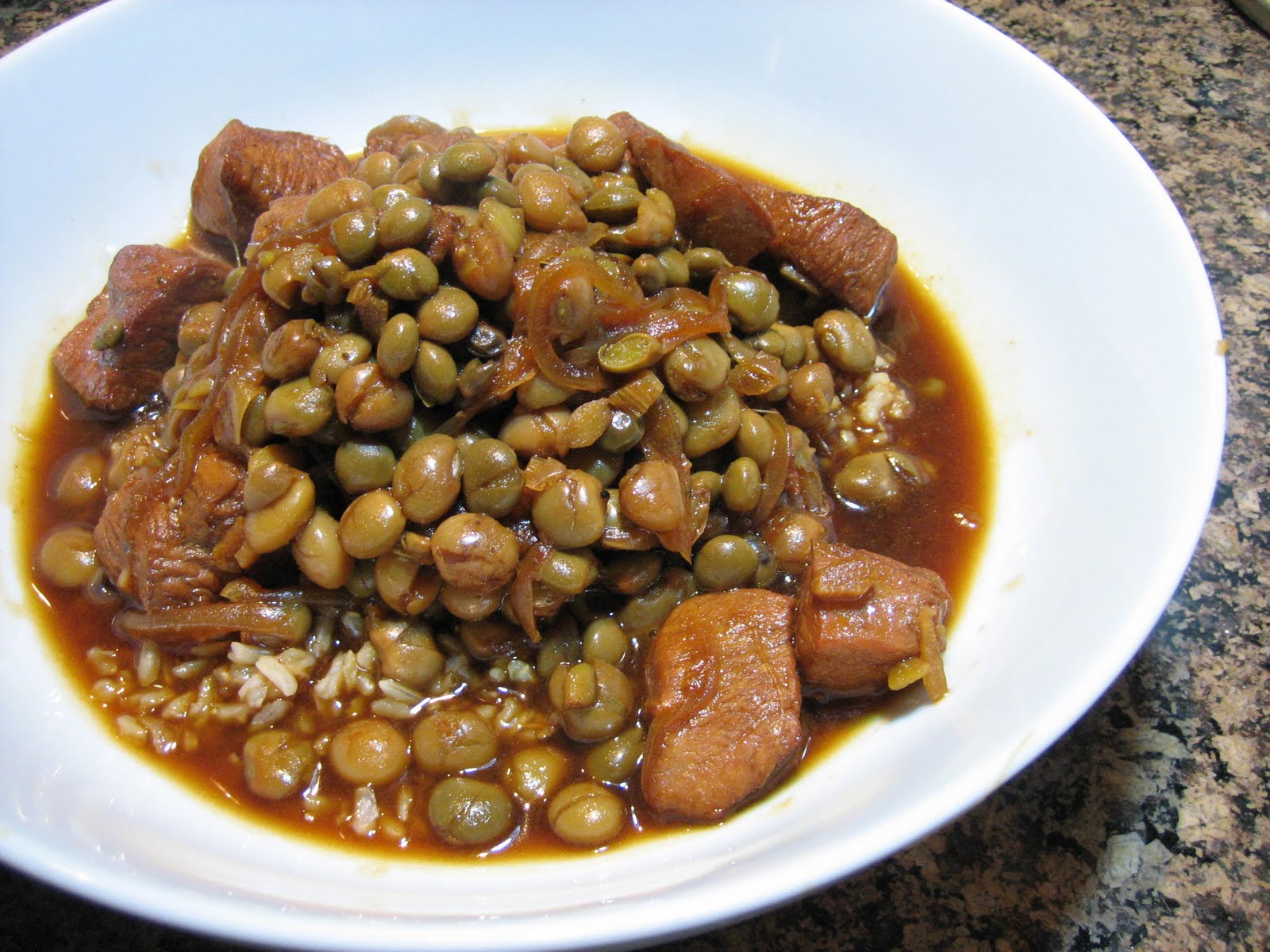 Living on Pure Land Stew chicken and pigeon peas over brown rice with