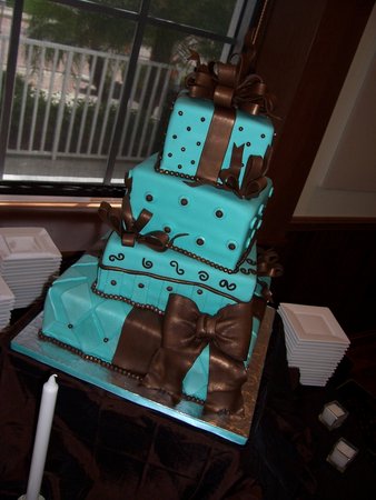 Tiffany blue square wedding cake in the shape of presents with brown ribbon