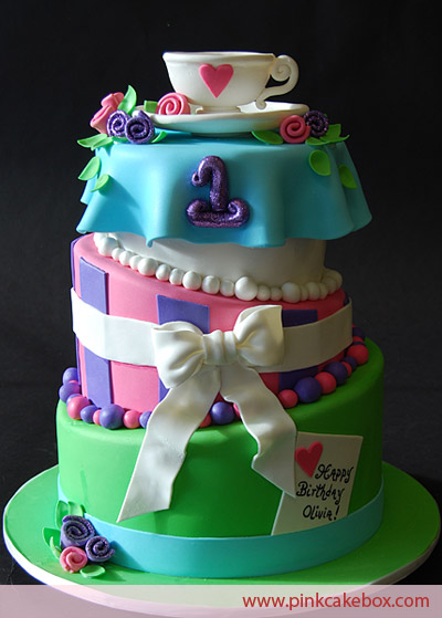 Lovely Mad Hatter Cake four tier wedding cake in blue purple green 