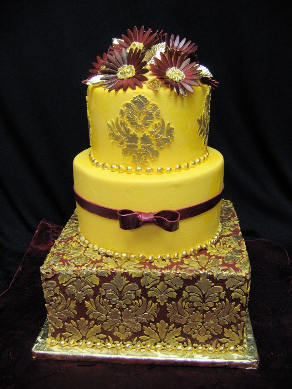 Gold yellow and burgundy damask pattern wedding cake