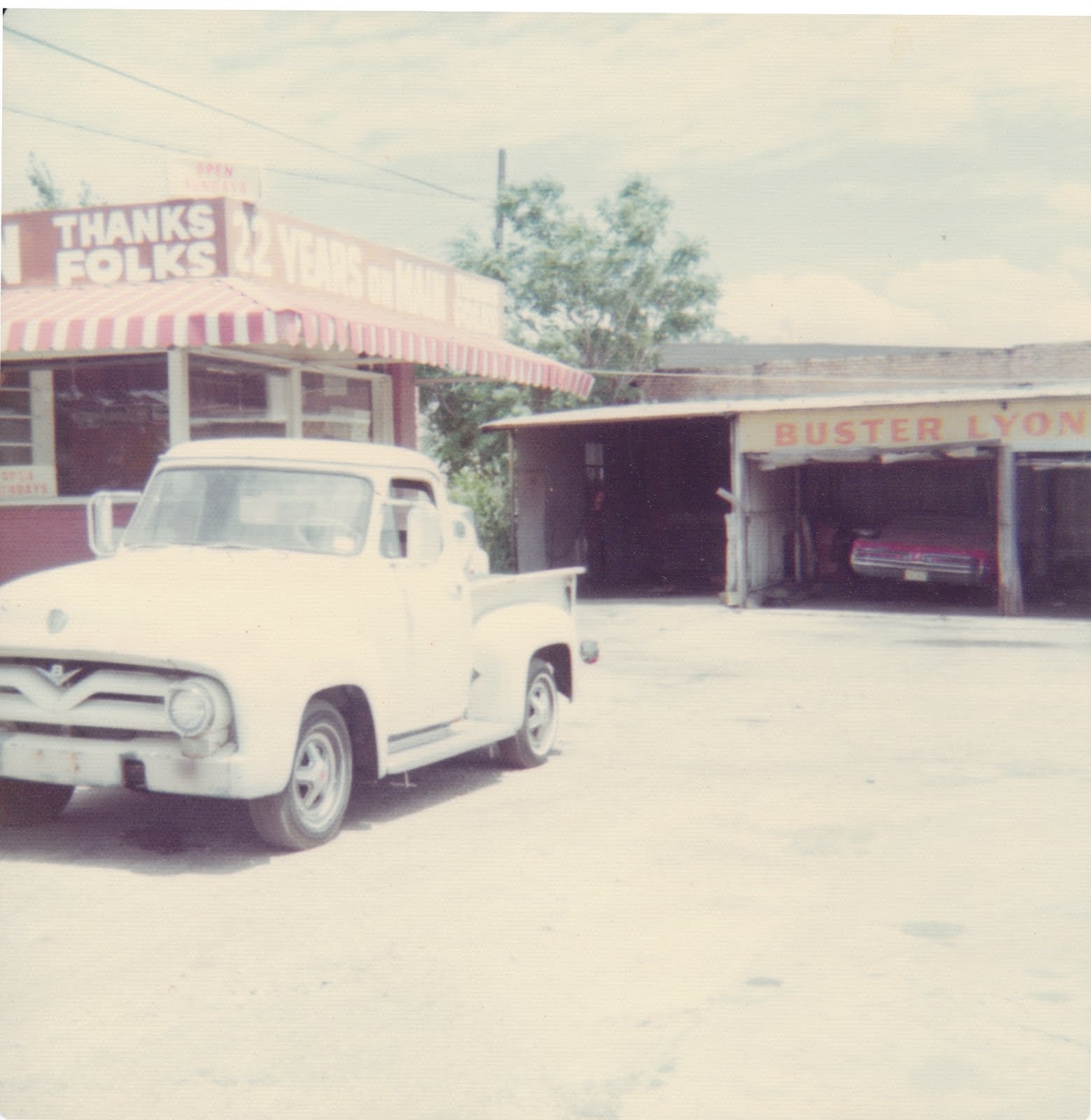 Old Ford pick up on the lot of Buster Lyon Auto Co. in 1975 New Car Concept