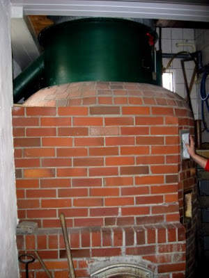 The wood-fired kettle, with the lauter tun above