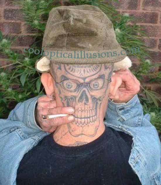 Tattoo, like a face in back of face, smoking