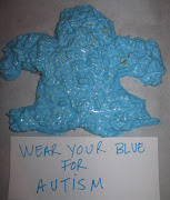 A Blue Autism Speaks puzzle piece . out of a rice crispy treat!