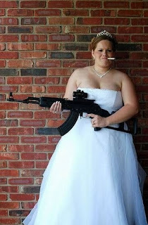 bride wedding photo holding a gun1