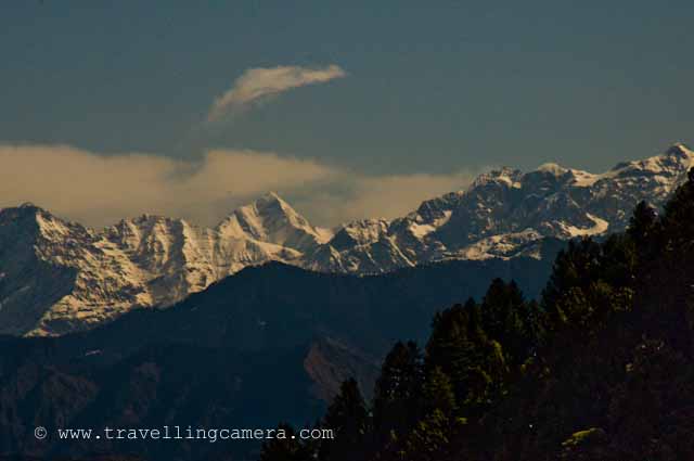 View of Peer Panjal Mountain Range from Dalhousie @ Himachal Pradesh, INDIA : Posted by VJ SHARMA at www.travellingcamera.com : Pir Panjal Range is a mountain range in the Middle Himalayas running from east south east to west north west across the states of Himachal Pradesh and Indian administered Kashmir in the Republic of India as well as Pakistan administered Kashmir... All these photographs have been clicked during one of m Dalhousie trip... Dalhousie Mall Road has amazing views to PIR PANJAL mountain range... Here are few photographs of PIR PANJAL which are clicked from Mall Road @ Dalhousie, Chamba, Himachal Pradesh, INDIA Dalhousie Mall road starts from Subhash chowk and this photograph has been clicked after few minutes of walk from Subhash Chowk.. towards main market of Dalhousie, also known as Gandhi Chowk...The eastern segment of the range forms the watershed that separates the Chenab (Chandrabhaga) river basin from the Beas and Ravi river basins...Zoomed view of PIR PANJAL from middle of the Mall Road @ Dalhousie, Chamba, Himachal Pradesh... I have used Nikon D90 with 18-200mm to click all these photograph.. and most of them are clicked in the evening....Rohtang La is a mountain pass on the eastern Pir Panjal range. It connects Manali in the Kullu Valley to Keylong in the Lahaul Valley. ..This is clicked from Gandhi Chowk and the green hill on the right is the one where Dalhousie Public School is situated... Its very popular boarding school in Himachal Pradesh...Haji Pir Pass is a mountain pass on the western Pir Panjal range between Poonch and Uri (India).Haji Pir Pass is an important outpost manned by the Pakistan Army. The pass witnessed Pakistani aggression during both the 1965 and 1971 wars. India captured this pass in the 1965 war due to lack of Pakistani strength in that area and was later returned to Pakistan during exchange of each others territories. During the 1971 war, Pakistan army repulsed to Indian attacks on the post. This pass today continues to be part of Pakistan Occupied Kashmir...Clouds moving up from PIR PANJAL mountains... and let me share that Dalhousie gets heavy rainfall in himachal pradesh ... snowfall also...Deo Tibba (6001 m) and Indrasan (6221 m) are two important peaks at the eastern end of the mountain range. They can be approached from both the Parbati-Beas Valley (Kulu District) and the Chandra (Upper Chenab) Valley (Lahaul and Spiti District) in the Indian state of Himachal Pradesh.The hill stations of Gulmarg in the Indian state of Jammu and Kashmir lies in this range.