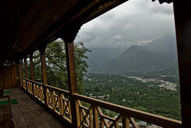 Naggar Castle is my favorite place to stay in Kullu-Manali Region of Himachal Pradesh... Last year when I visited Manali, we spent some very good time here at Nggar Castle Hotel of HPTDC and here I am going to share some wonderful views of Kullu Valley and adjacent hills...This hotel has some extended balconies in all the directions facing Kullu Valley... There are some unique galleries around the hotel which are made up of wood only... Iron sheets are used at some places on the roof-top because of heavy snowfall...Here comes the first view of Kullu Valley having lot of apple orchids, Beas River, clouds and green areas... This balcony was just outside the rooms in Naggar Castle...Hotel Castle is an unique medieval stone and wood mansion once the home to the Raja of Kullu and now an HPTDC Heritage hotel...  On moving eyes up to 60 degree, there are amazing views of hills covered with snow or clouds...Another view to opposite side of the valley from extended balcony of Naggar Castle restaurant....Naggar Castle overlooks the Kullu Valley and apart from the spectacular view & superb location this has a flavor of authentic western Himalayan architecture....King's Castle was converted into a rest house a hundred year back and in 1978 this ancient building was handed over to HPTDC to run as a heritage hotel...Here is a view of Naggar town from Castle premises....A view of extended balcony of Naggar Castle and cloudy hills in he background...Here a gallery houses the paintings of the Russian artist Nicholas Roerich...Naggar Village @ Kullu, Himachal Pradesh, INDIARooms at Naggar Castle are airy, spacious, well furnished with Parking within premises.... There is an Art Museum in ground floor of the Hotel... Here is my friend Nitin, who kept clicking photographs of this amazing place throughout our stay at Naggar Castle...Here is another view of Naggar from Hotel Resurant @ Naggar Castle... Hotel has Restaurant serving Indian, Continental, Chinese and Himachali cuisines....A photograph of open area inside Hotel premises which is bonfire or evening snacks... If you are wondering how this photograph is clicked because there is deep valley next to the Hotel ; its clicked from extended balcony of the rooms available for stay...Same view again...Kullu Valley which is also known as the 