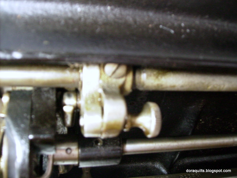 Dora Quilts How do I lower feed dogs?