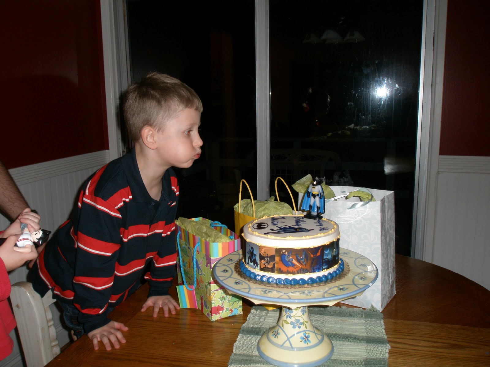 [2009+austin+birthday+blowing+out+candles.JPG]