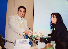 Suchit Dave presented with bouquet at Seminar on "Judicial Reforms"