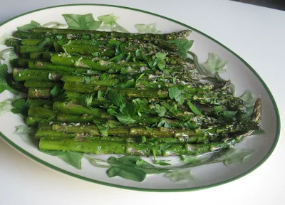 Baked Asparagus, baked with olive oil, minced garlic, and a sprinkle of parmesan cheese. Easy and elegant!
