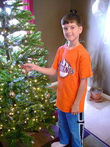 Logan adding some ornaments...
