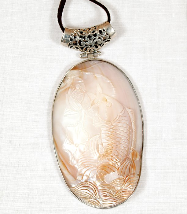 [Fish+pendant+-+hand+carved+mother+of+pearl+-+www.ShopCurious.com.jpg]