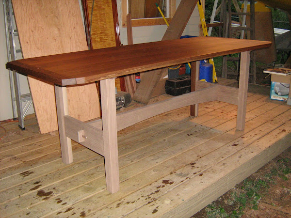 Custom table in walnut uncompleted oil finish.