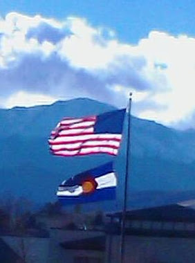 Colorado flag in front of Pikes Peak