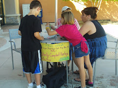 Kids receiving giveaways at book signing!