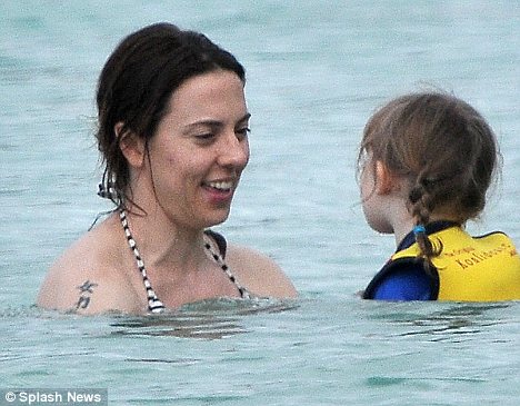 Mel C shows off her muscles on the beach with daughter Scarlet