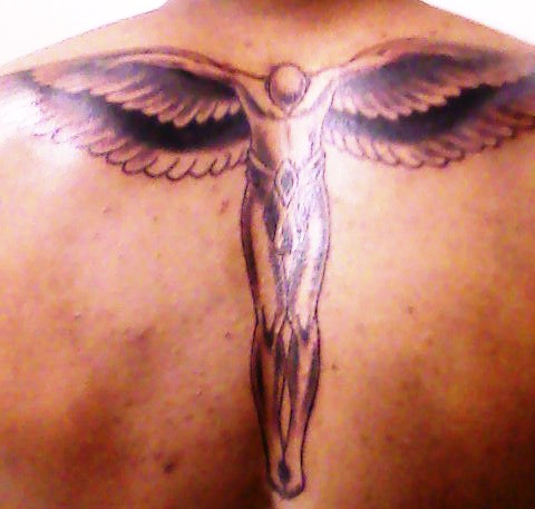 Tattoos Of Wings On The Back. Open wings on center of guys