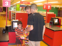 Bryan and Andrew checking out JD's groceries
