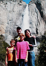 my family underneath a waterfall at yosemite