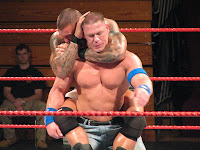 Orton has Cena in a sleeper hold
