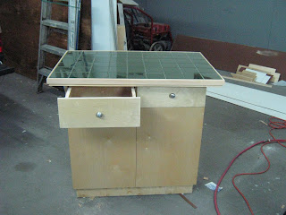 FERNANDEZ CABINET: ISLA PARA COCINA EN CONSTRUCCION. ESTA REVESTIDA EN