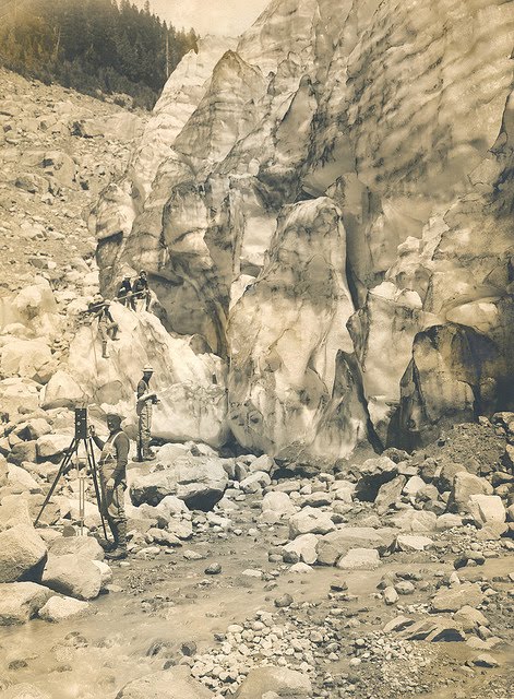 Image Title: Man with motion picture camera near glacier, Mt. Rainier. Creator: Kiser Photo Co. Date Original: 1905. Original Form: Gelatin silver prints. Original Collection: Gerald W. Williams Collection