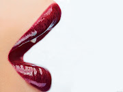 So, my beauty tips of the day is to use red lipstick next time you go out or . (woman glossy red lips )