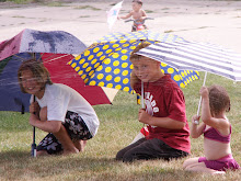 Hannah, Grant, and Cora~Umbrellas to "save them" from getting wet....didn't work out so well!