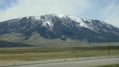 See Snow on Mountains Driving to Deer Lodge, Montana