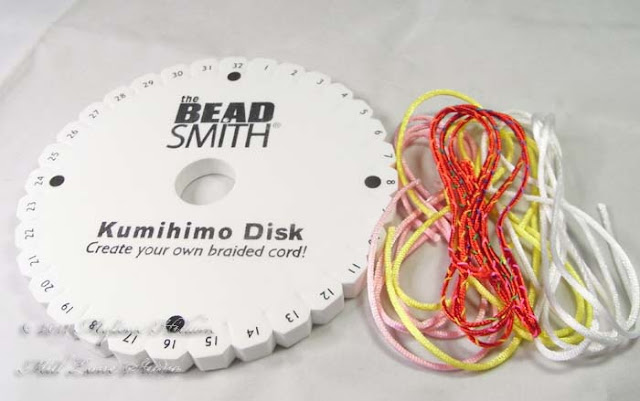 Kumihimo basics: the materials that you need are a Kumihimo disk and cord.