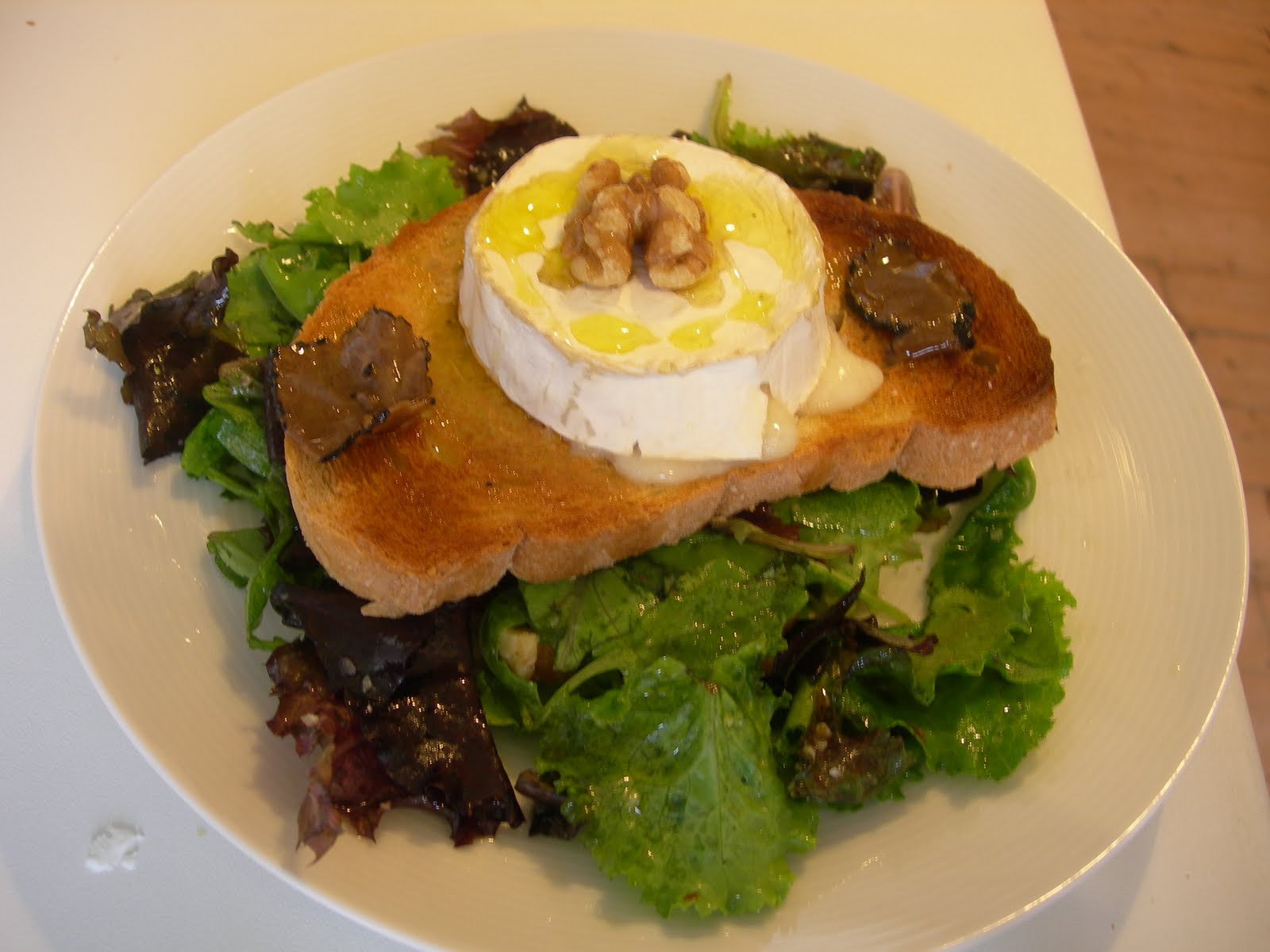 Focaccia al Rosmarino Warm Goat's Cheese, Black Truffle and Walnut Salad