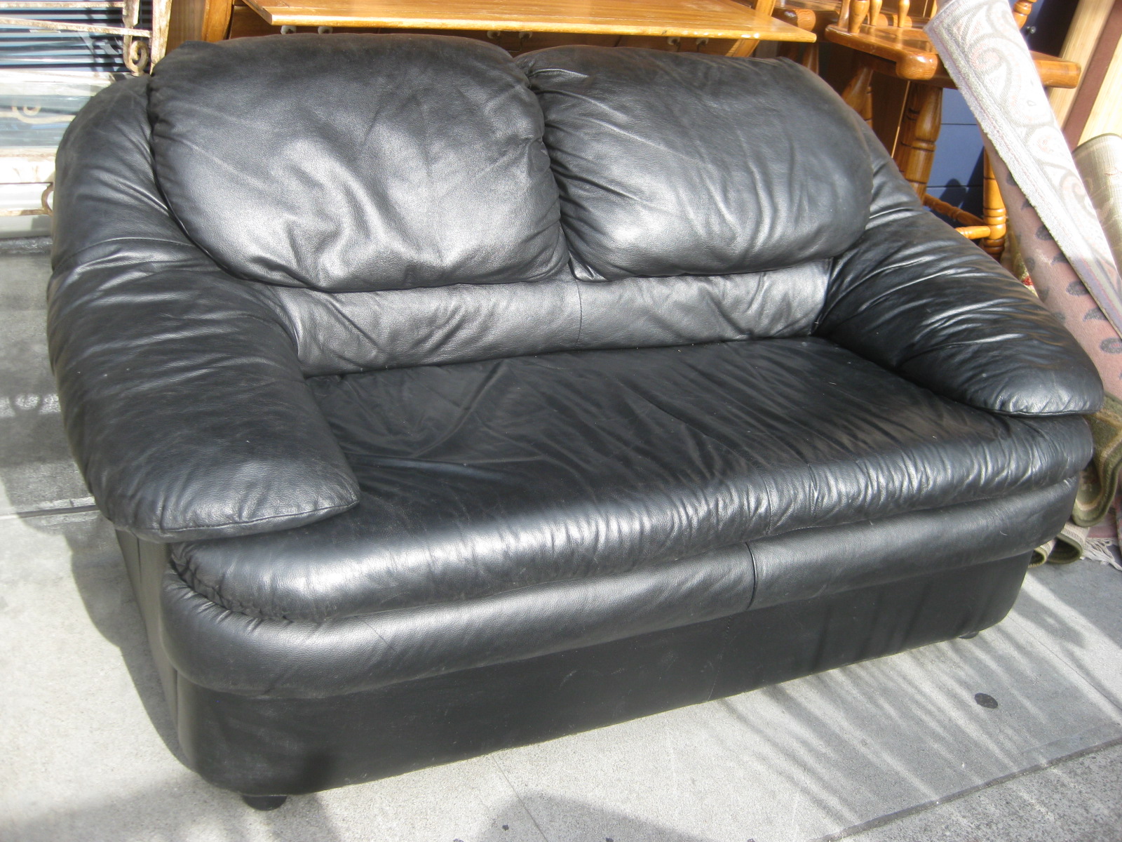 UHURU FURNITURE & COLLECTIBLES SOLD Black Vinyl Loveseat 100